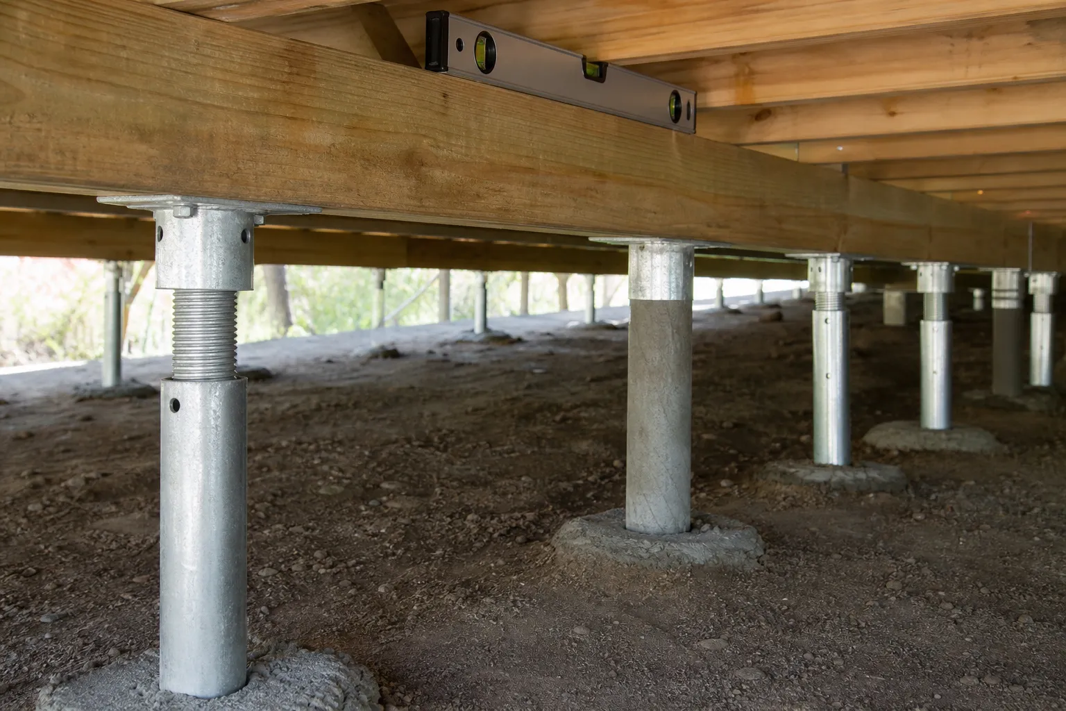 A completed restumping job under a Geelong home, new stumps set level